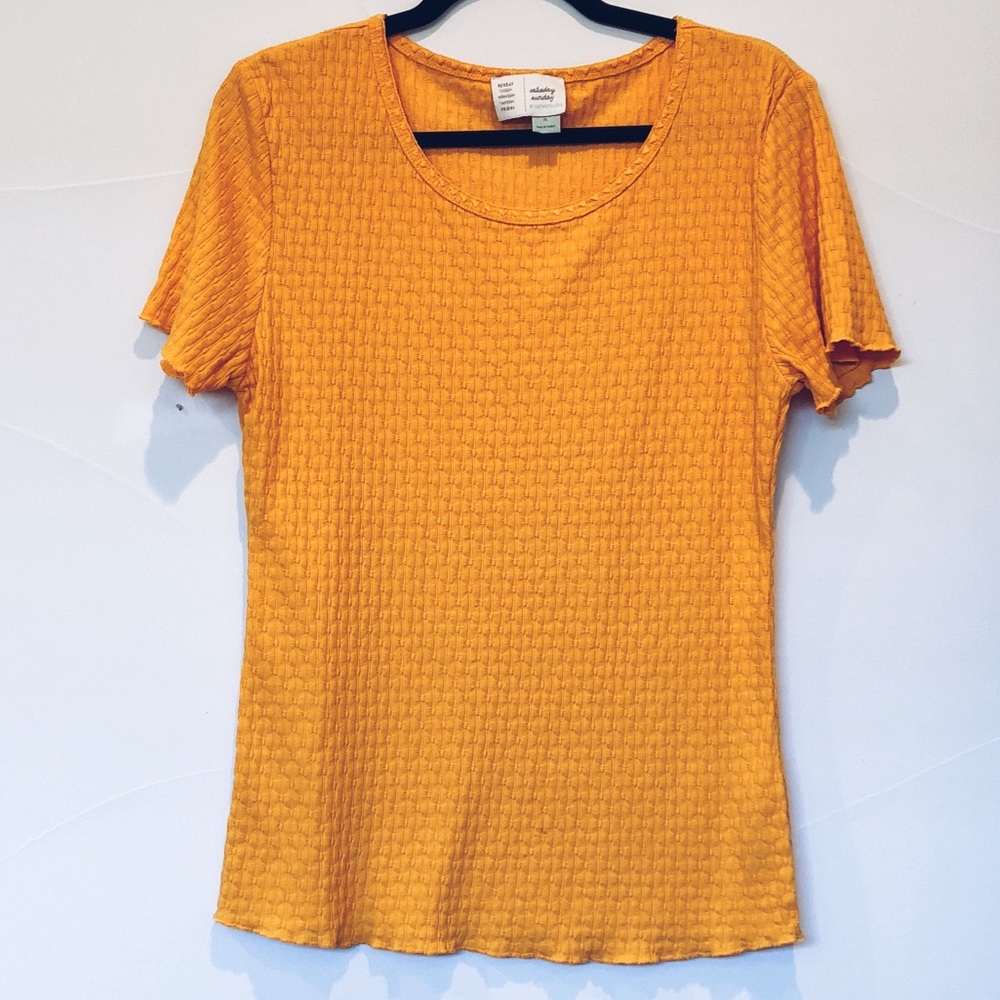 Marigold short sleeve shirt with design.
